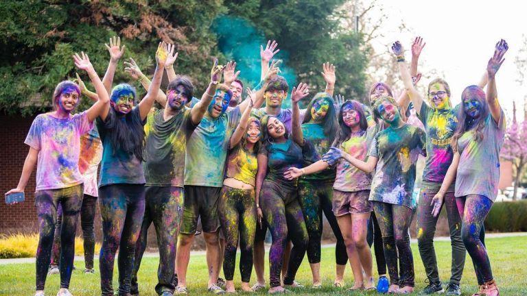 students celebrate holi